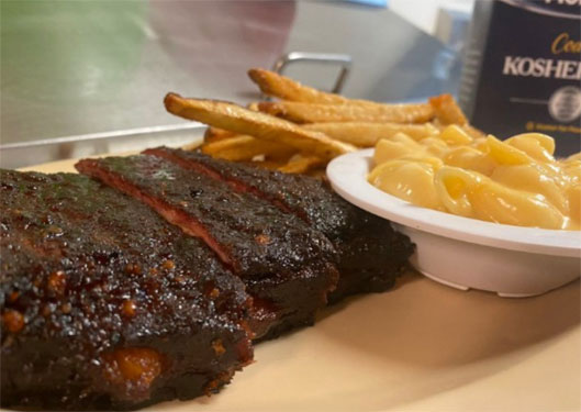 Rack of ribs with homemade mac & chees and hand cut fries at Greg's BBQ in Belen